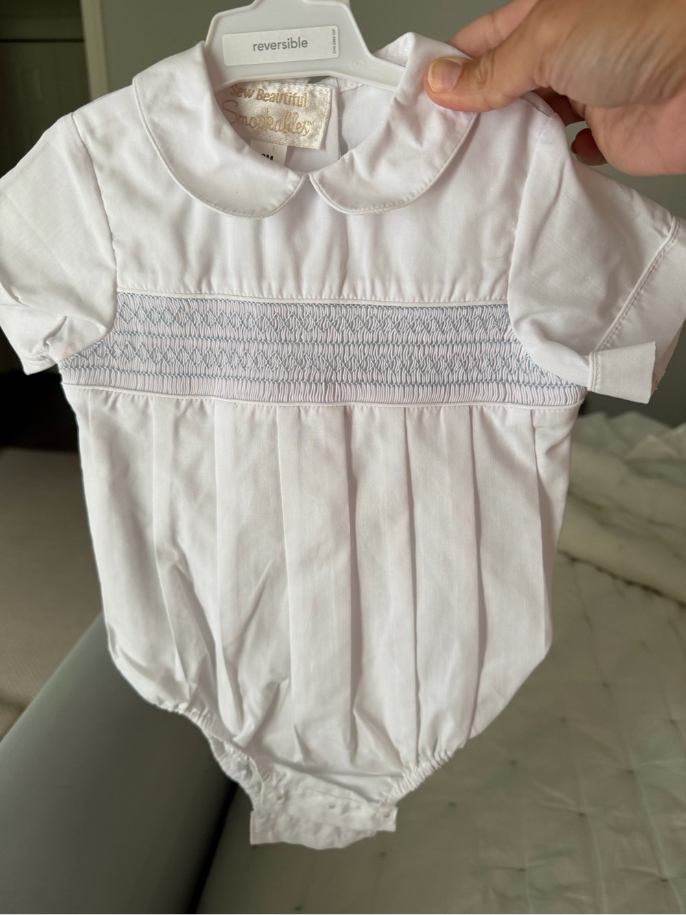 Classic White Smocked Baby One-Piece with Peter Pan Collar